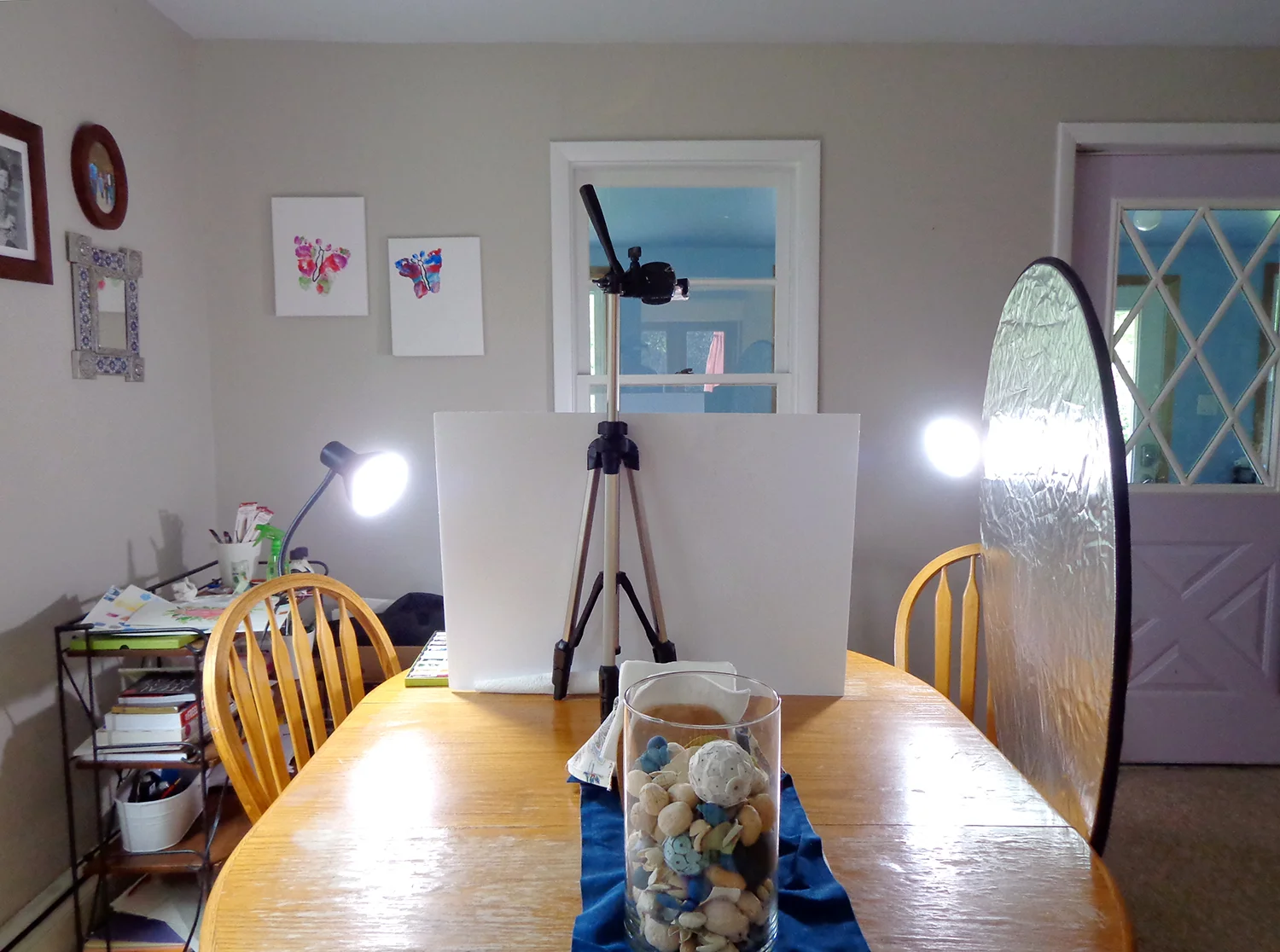 Lamps on either side of my work keep things bright and even, and a reflector placed opposite the window balances the natural light.