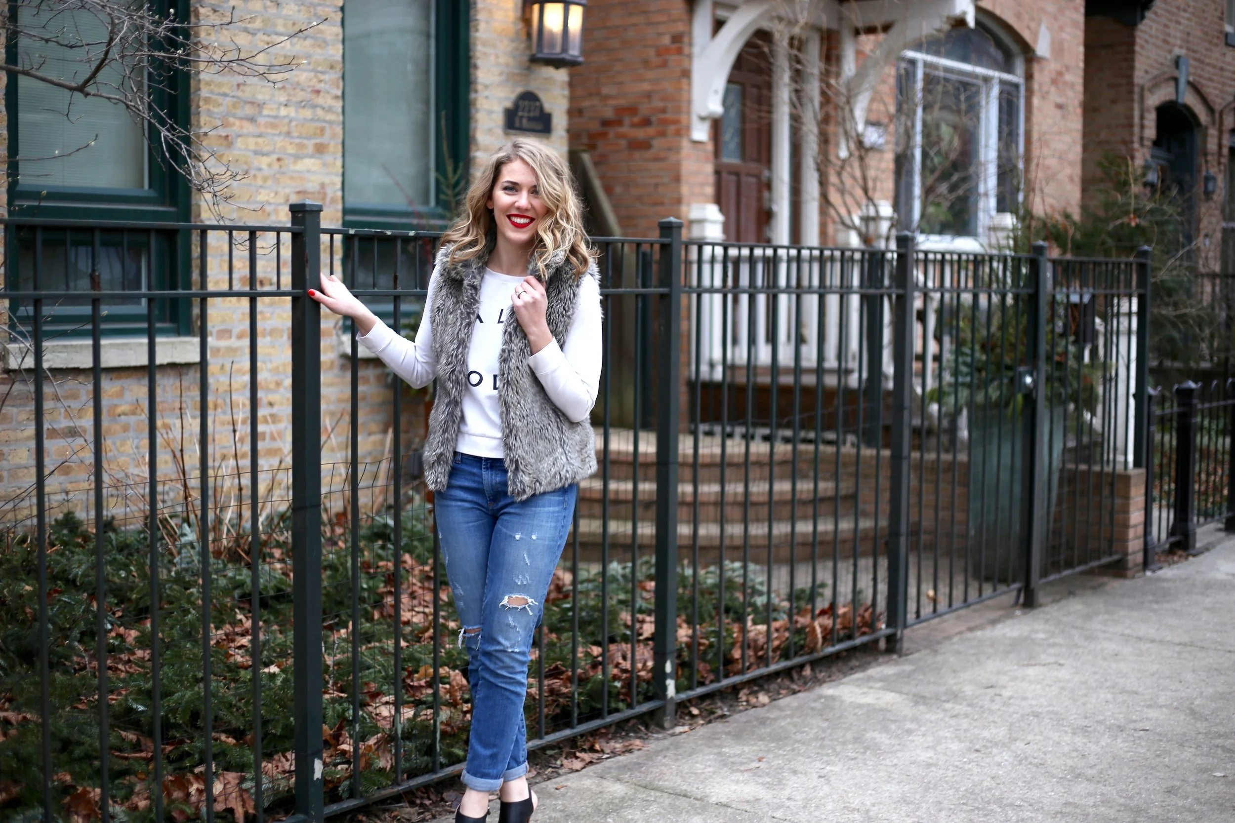 A red lip paired with a casual sweatshirt + boyfriend jeans? Instant outfit-maker