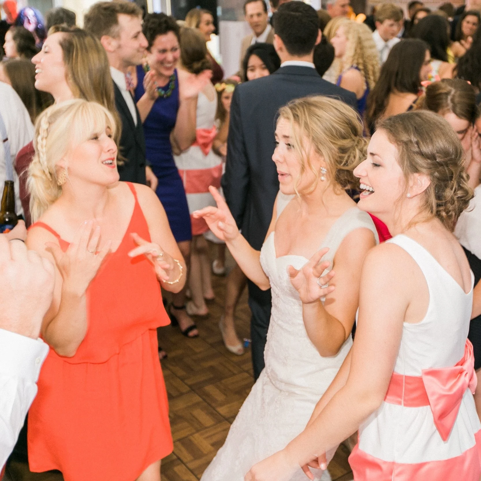 Emily, left, and Caroline, right, dancing with me at my wedding. Don't let their looks fool you—they are actually sisters!