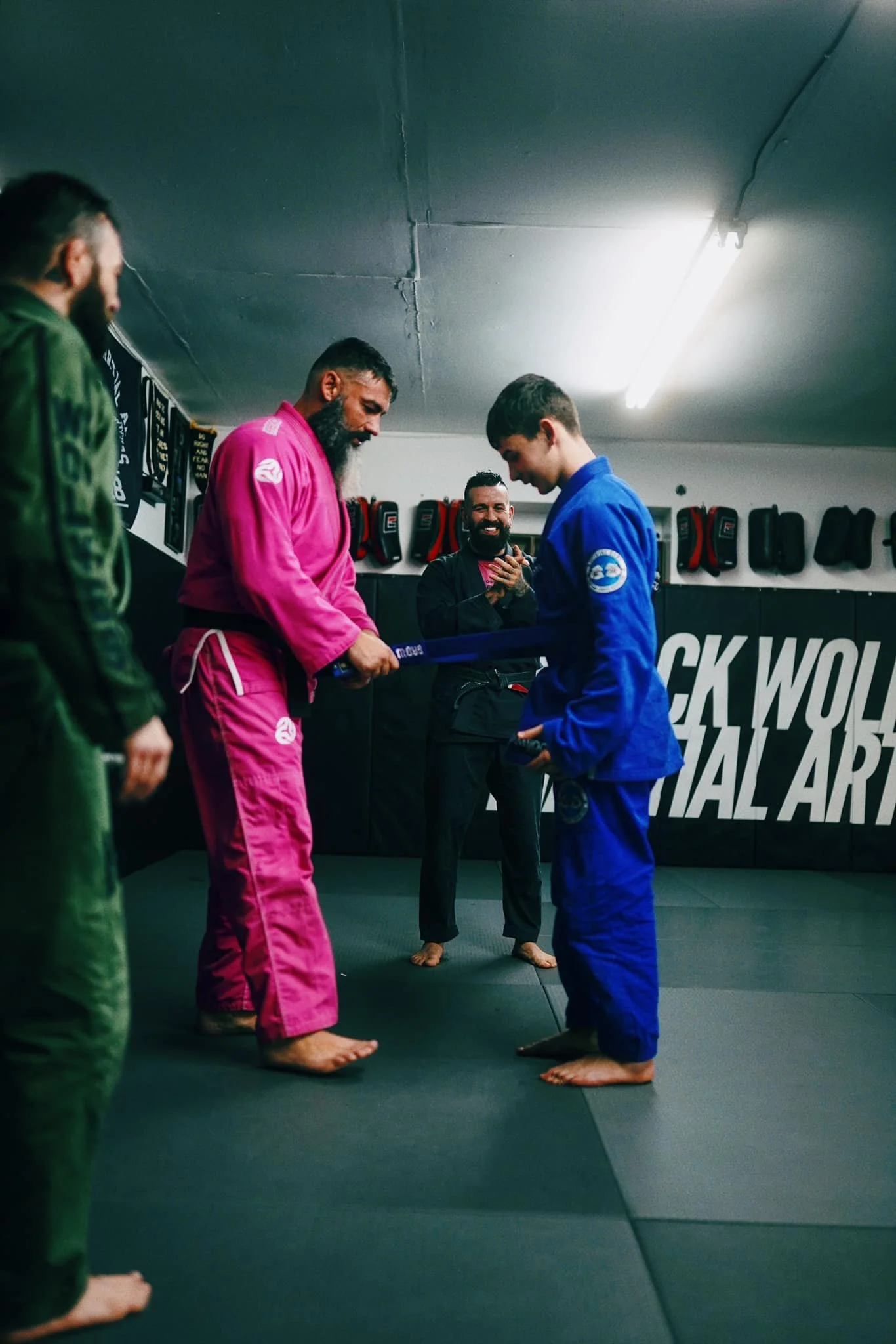 Coach and student at belt promotion