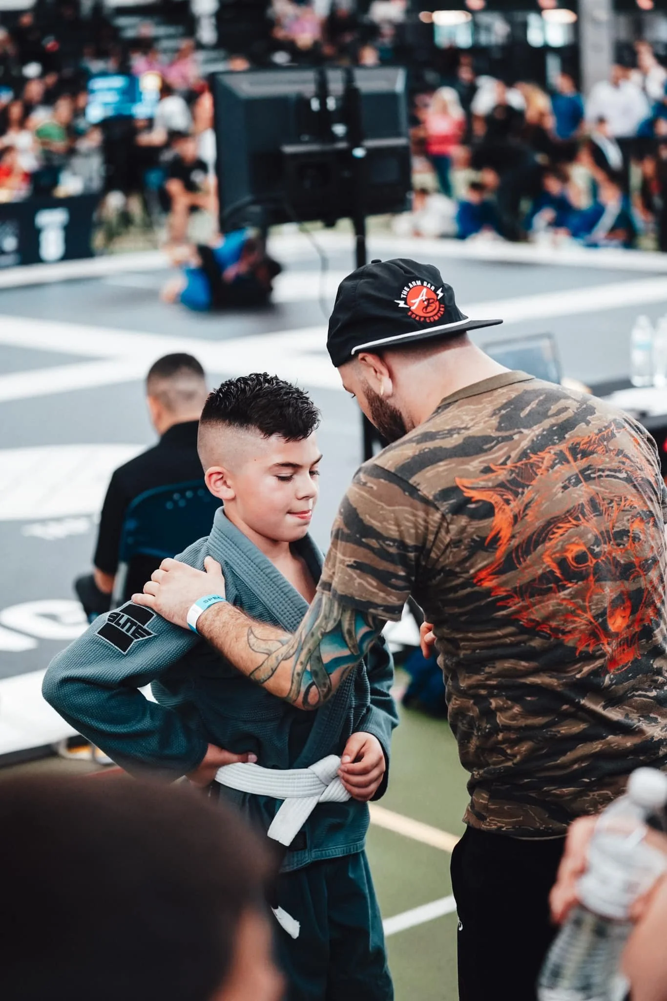 Coaching kids at jiu-jitsu tournament