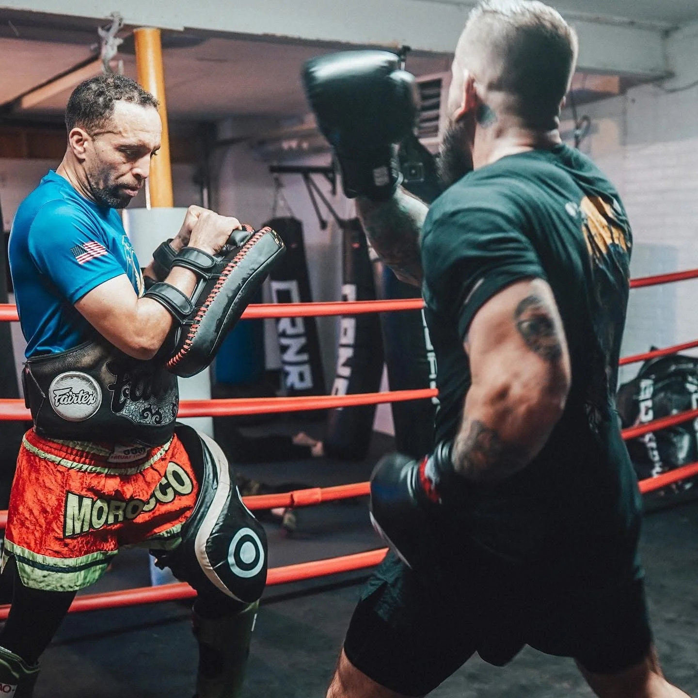 Practicing muay thai with pads