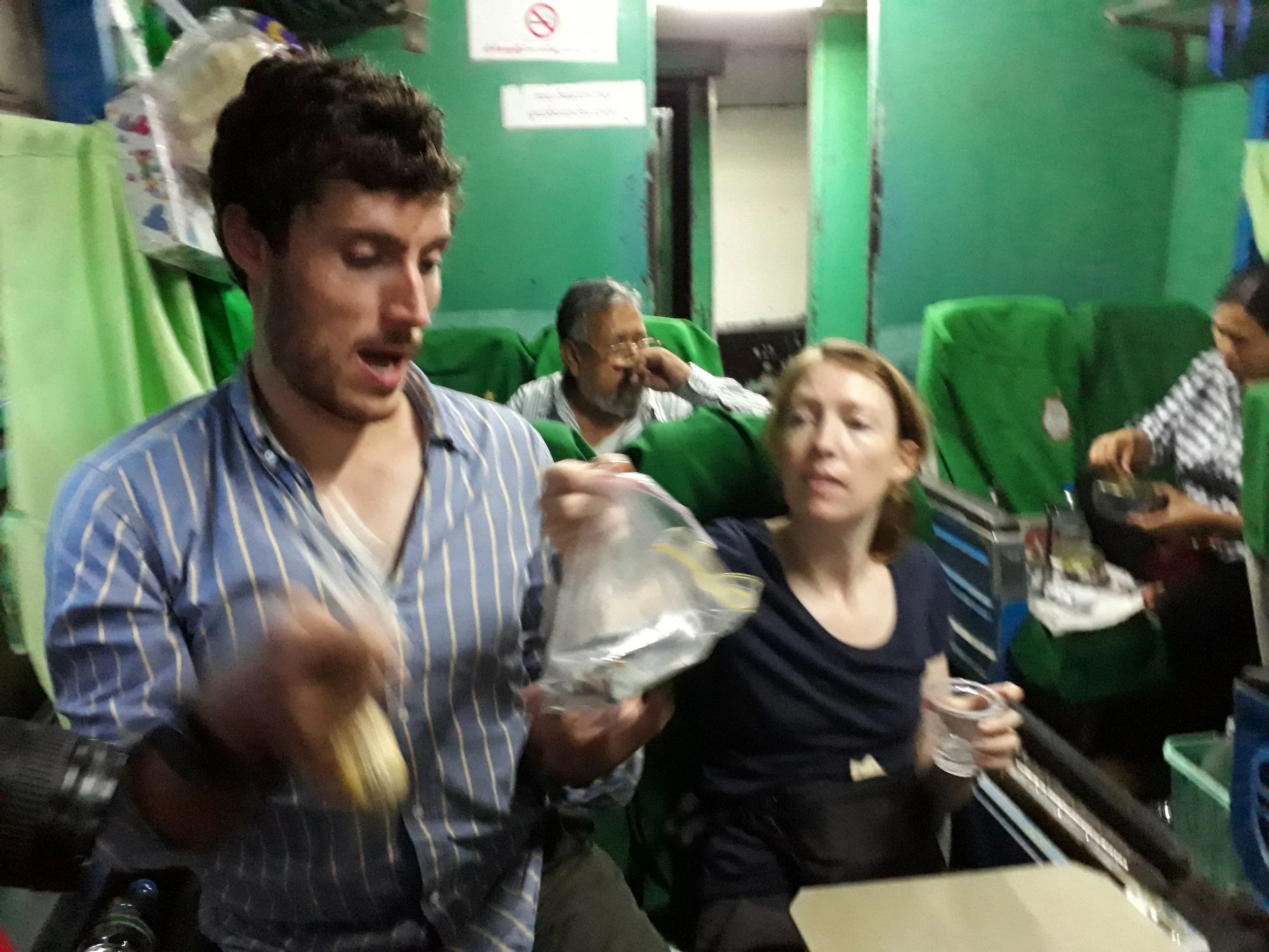 Ben juggling hot corn cobs and a plastic bag with butter which was getting beyond its use-by-date.