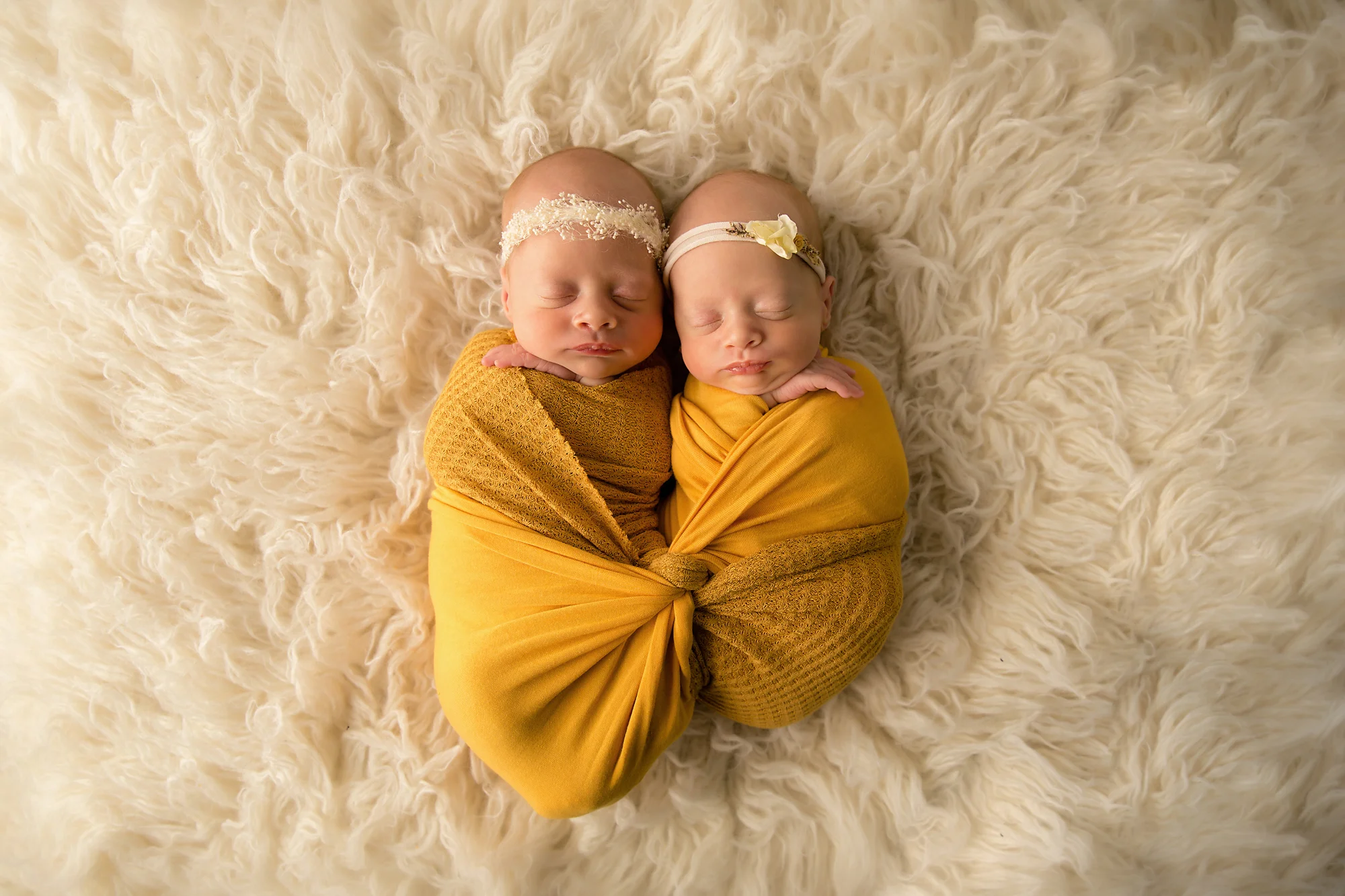 Twins Photography in Calgary, Alberta by Milashka Photography. One twin is 1 pound smaller then the other and it shows in this photo as they are both posed side by side.