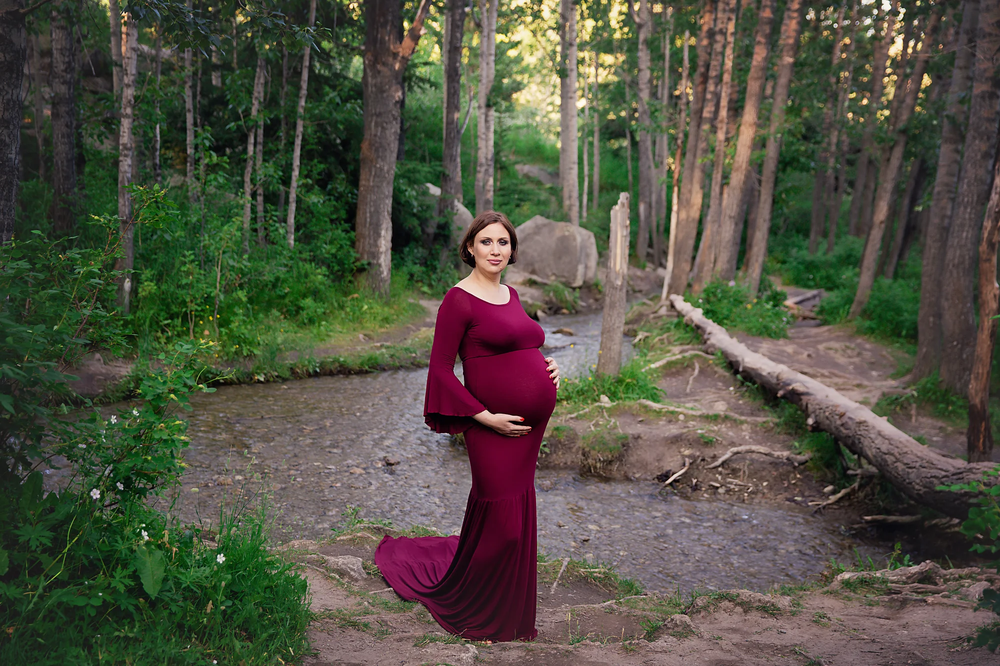 Mother-to-be is looking glamorous in this red gown. Calgary and Airdrie Maternity photographer