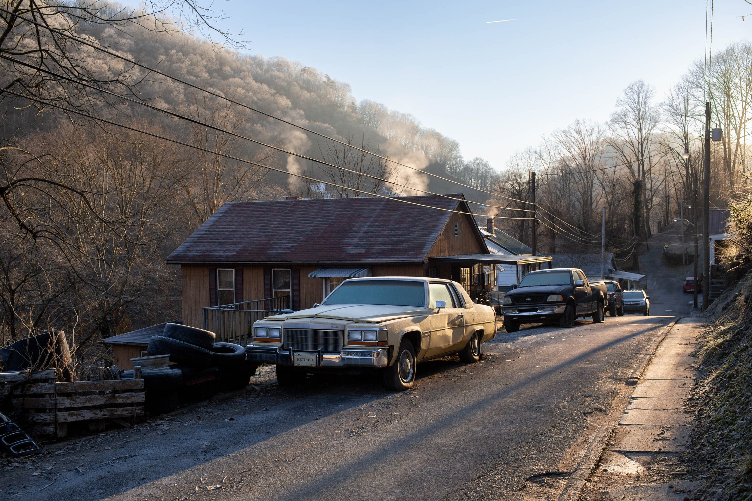  Detached houses in rural West Virginia are heated with coal- and wood-burning heaters. Welch, West Virginia, January 2019. 