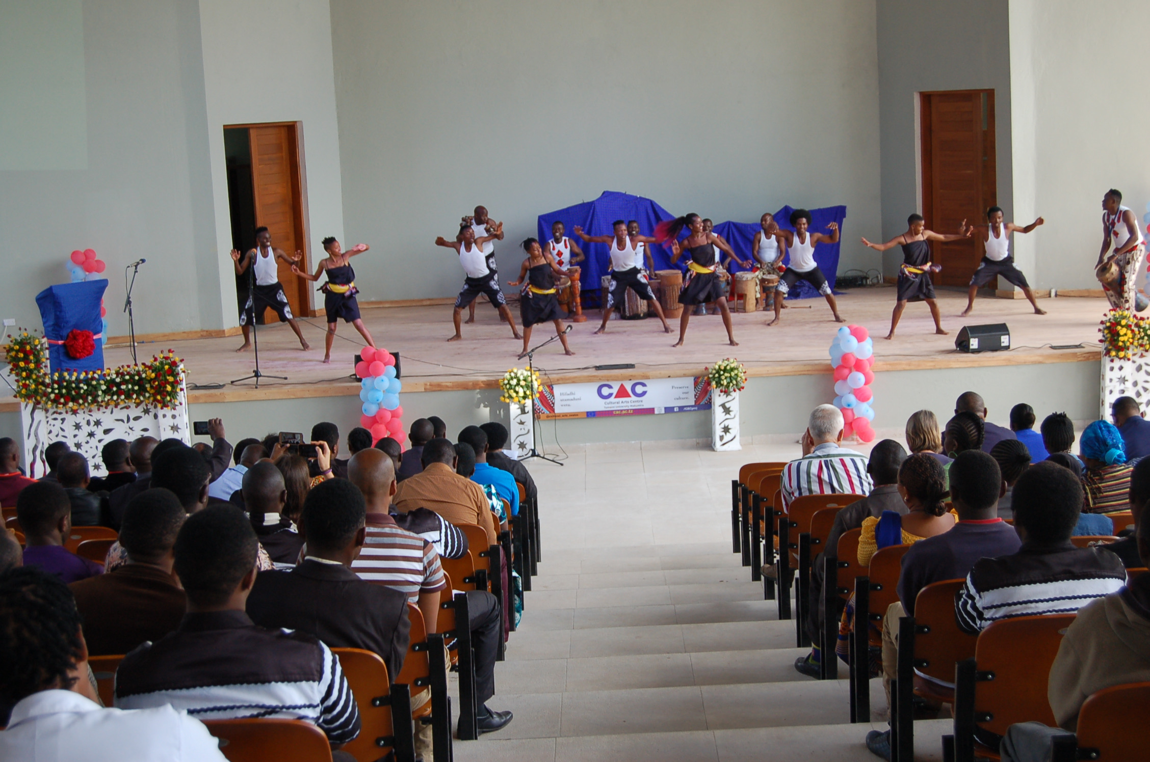  CAC dancers perform a traditional Southern Tanzania dance on the newly dedicated performance theatre during the Dedication Ceremony. 