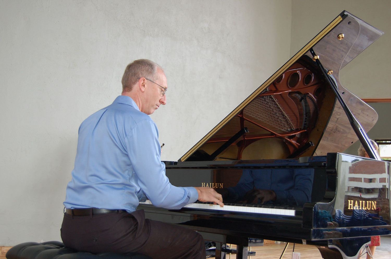  Randy Stubbs, CAC Programme Manager, plays the grand piano for the first time after it arrived from the United States of America. The piano is a gift from generous friends of the Music Department in America. 