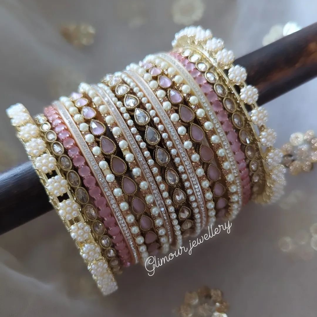 Statement full stone &amp; pearl baby pink bangle set 💗
Can be customised in any colour. We can also add red choora bangles to turn this design into a choora. 

Anything is possible with in house customisation while you wait. 

➡️DM to order/price. 