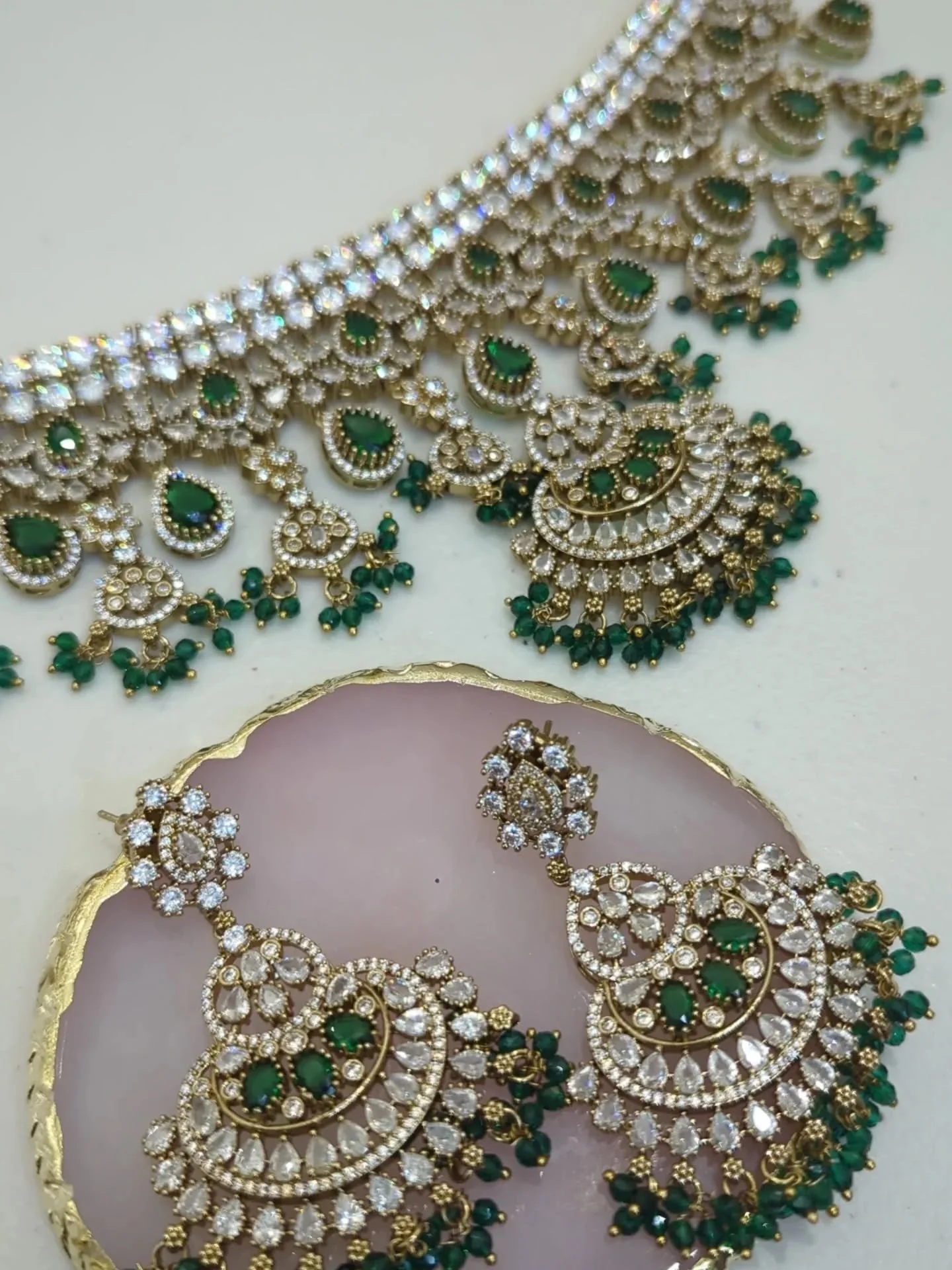 Stunning gold silver emerald green American diamond choker jewellery set with drop dangle earrings. 
Also available in ruby maroon &amp; neutral.
In stock &amp; ready to ship.

DM to order/price or book your bridal jewellery appointment in our showro
