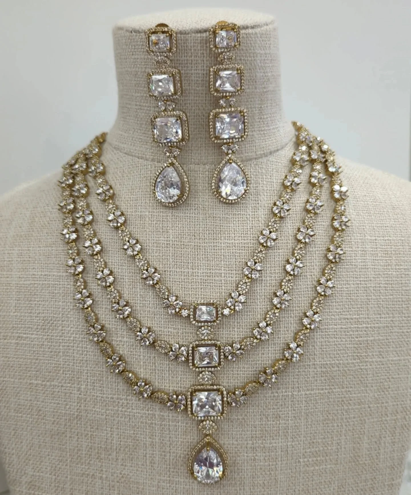 Layered gold silver American diamond neckline jewellery set with earrings. 
A stunning piece for bridal or party guest wear. 
Also available in full silver, green and maroon/ruby. 
In stock &amp; ready to ship. 

#americandiamond #receptionjewellery 