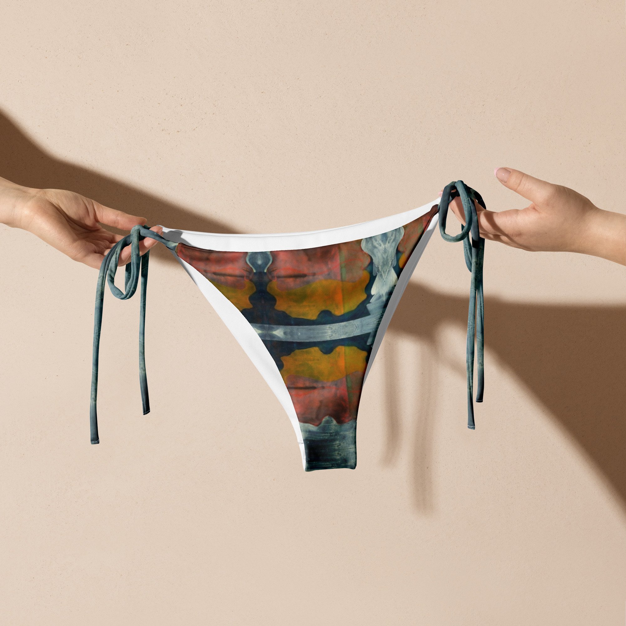 all-over-print-recycled-string-bikini-bottom-white-front-674a067ea921c.jpg