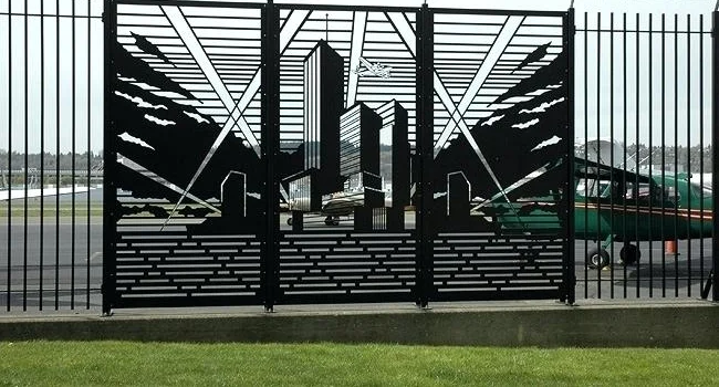 Ornamental steel fencing with accent infill panels (Image property of brandonemrich.com)