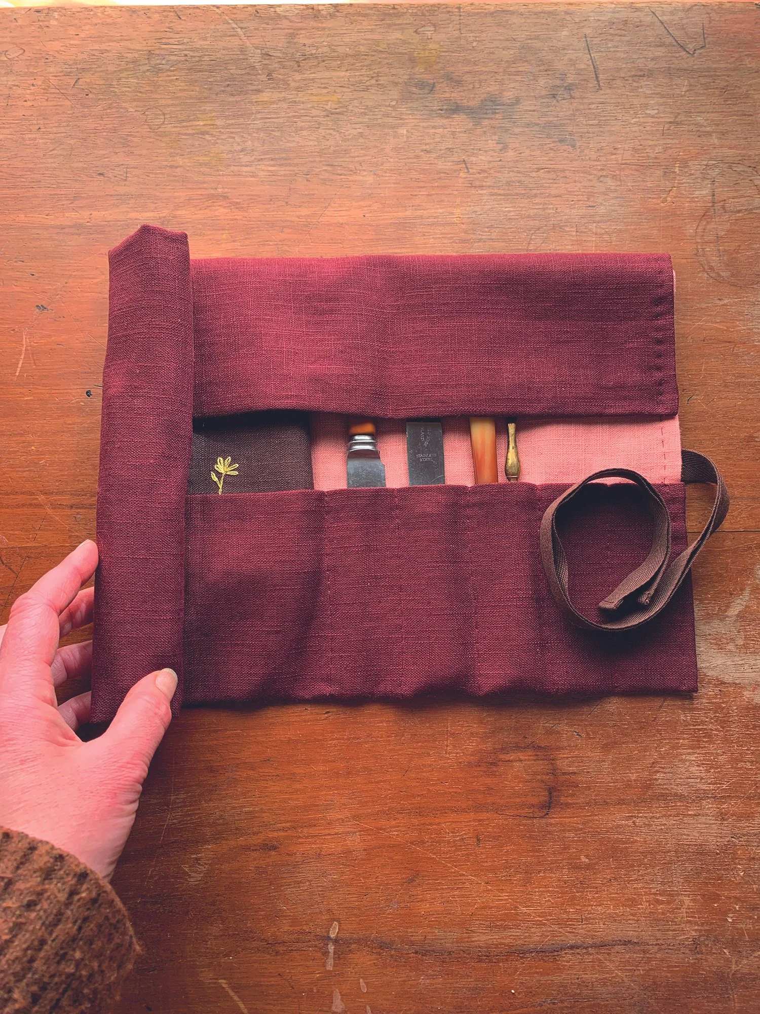 Linen wrap being rolled up.jpg