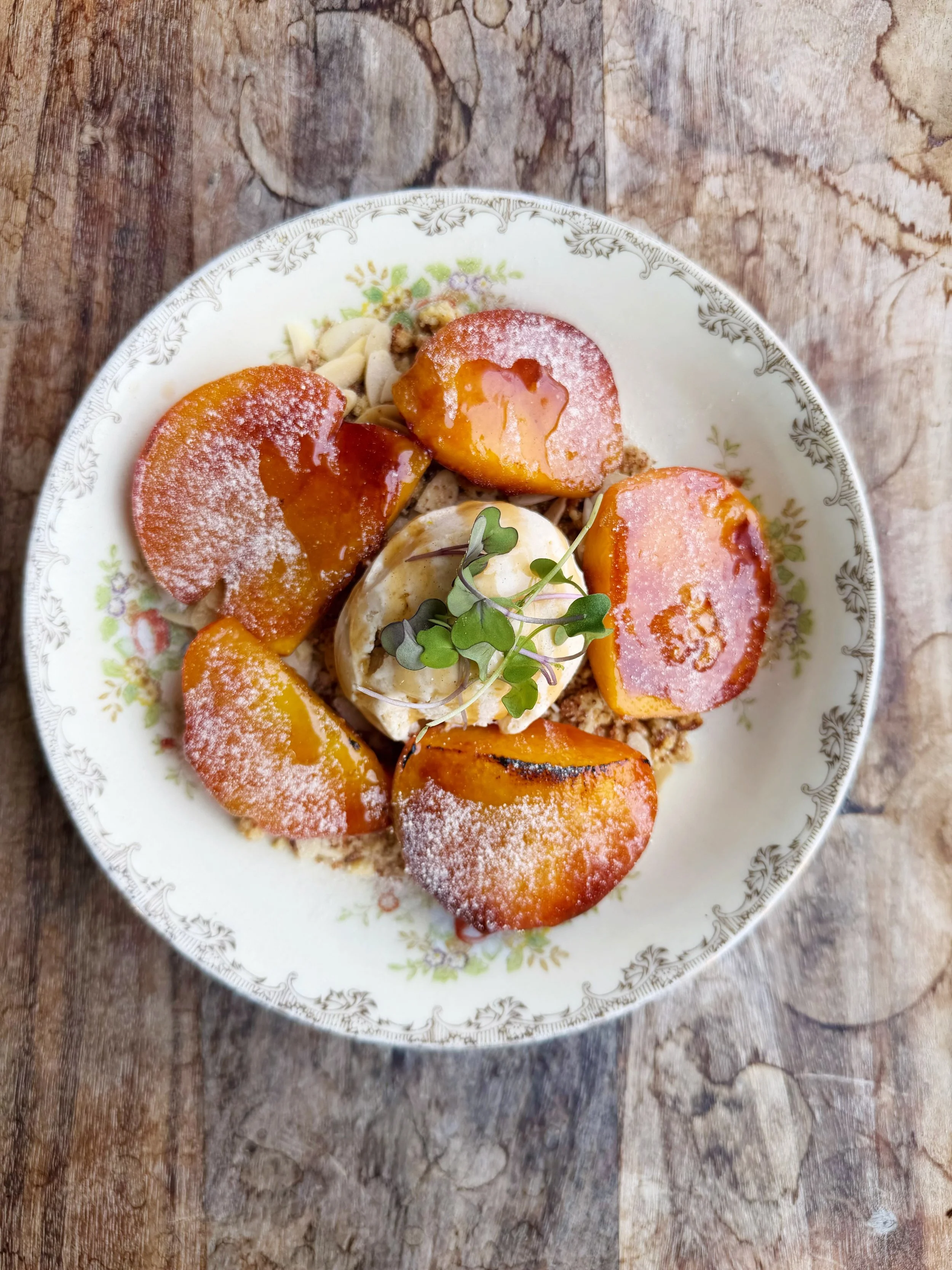 🍑🌿🍑🌿🍑🌿

Bennett Orchards peaches 
brul&eacute;ed with an olive oil cake crumble, 
salty crushed almonds, a peach drizzle 
&amp; homemade cinnamon-orange ice cream 

🍑🌿🍑🌿🍑🌿

the PATIO is open tonight&hellip;

be sure to book ahead for rese