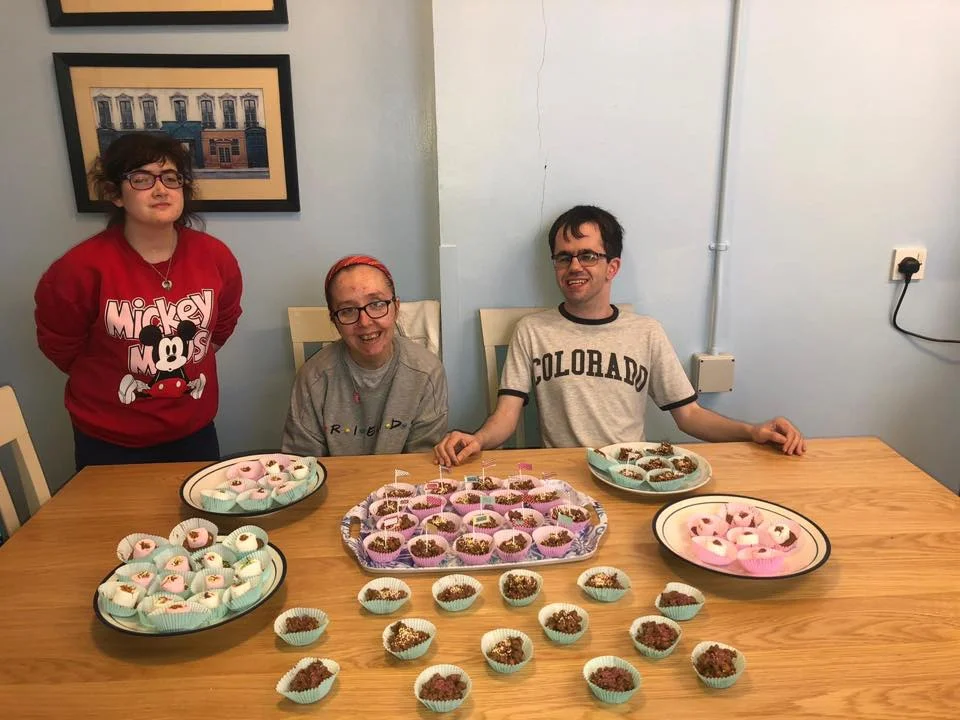 Freedom2Choose programme young people Robyn, Niamh and Gary baking delicious buns ahead of Saturday’s ‘World’s Biggest Coffee Morning’ event at Lilac House in aid of Macmillan Cancer Support.
