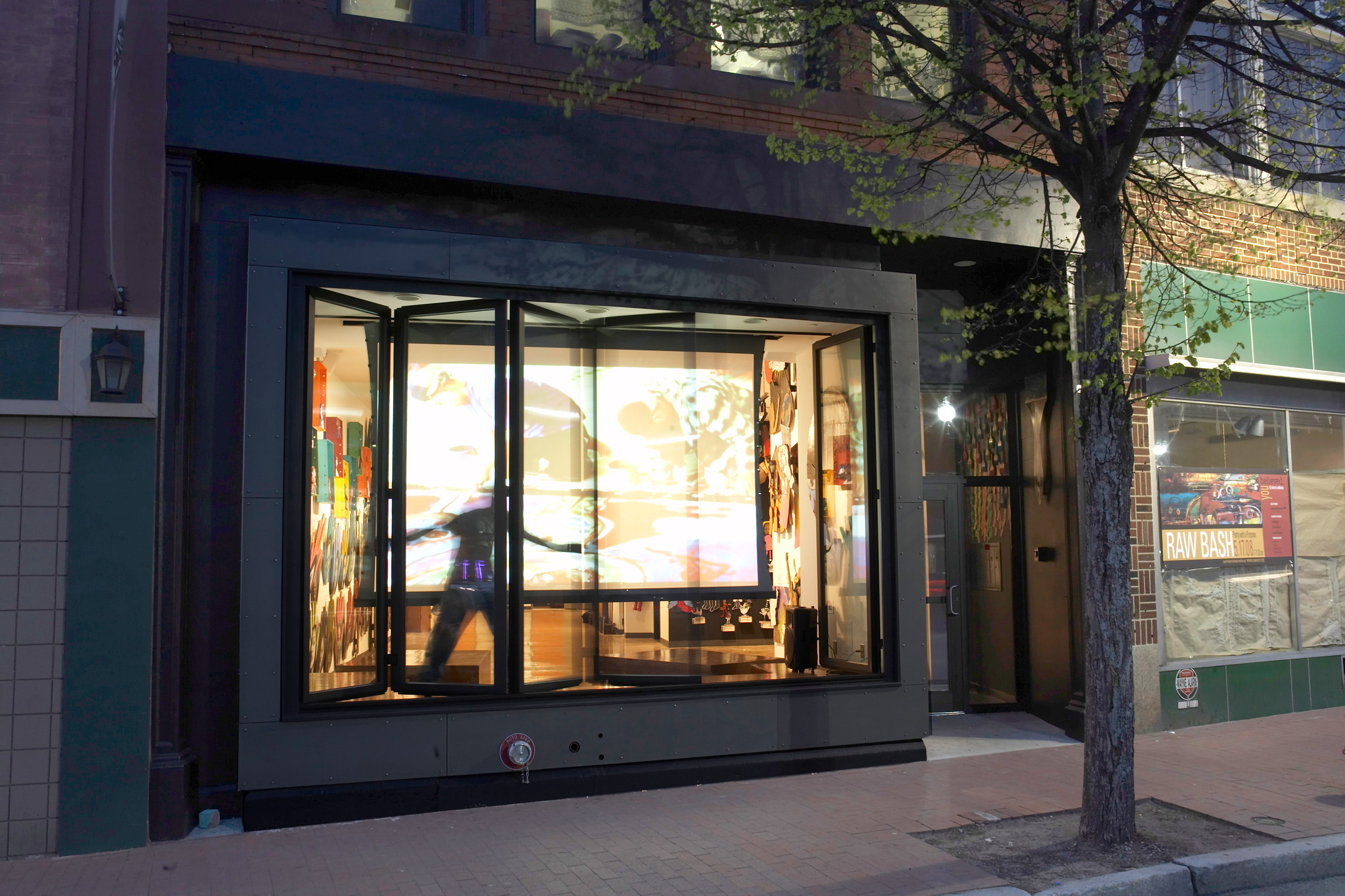 This box serves several functions: it can act as a store-front style display of RAW art and sculpture; a translucent screen drops down out of the ceiling allowing audiences to view films or slide presentations from in- and out-side the building...