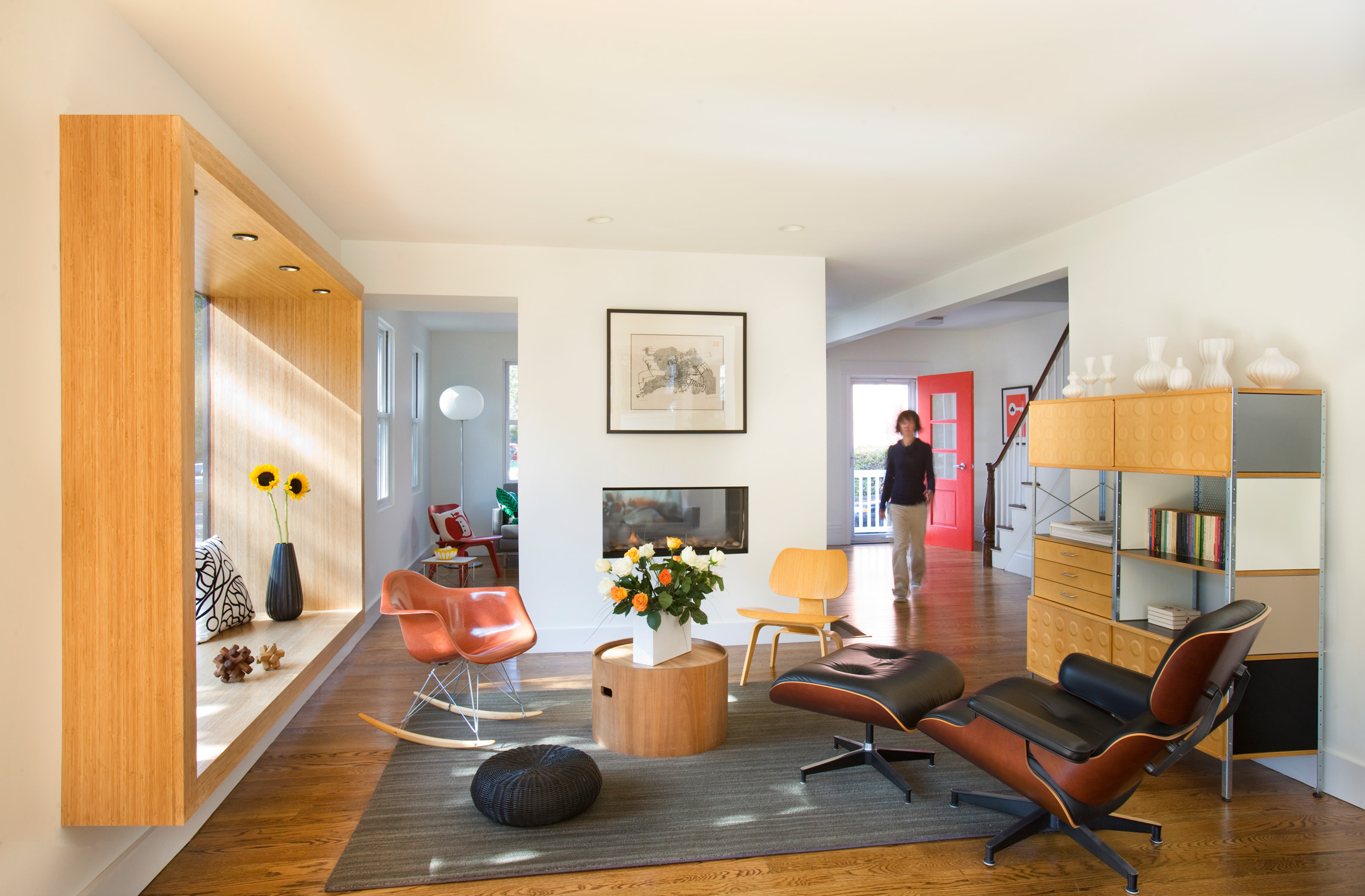 Extensive demolition of interior walls, and the replacement of an old, unsafe chimney with a new see-through fireplace, allows the entire first floor to flow together as a coherent space. 