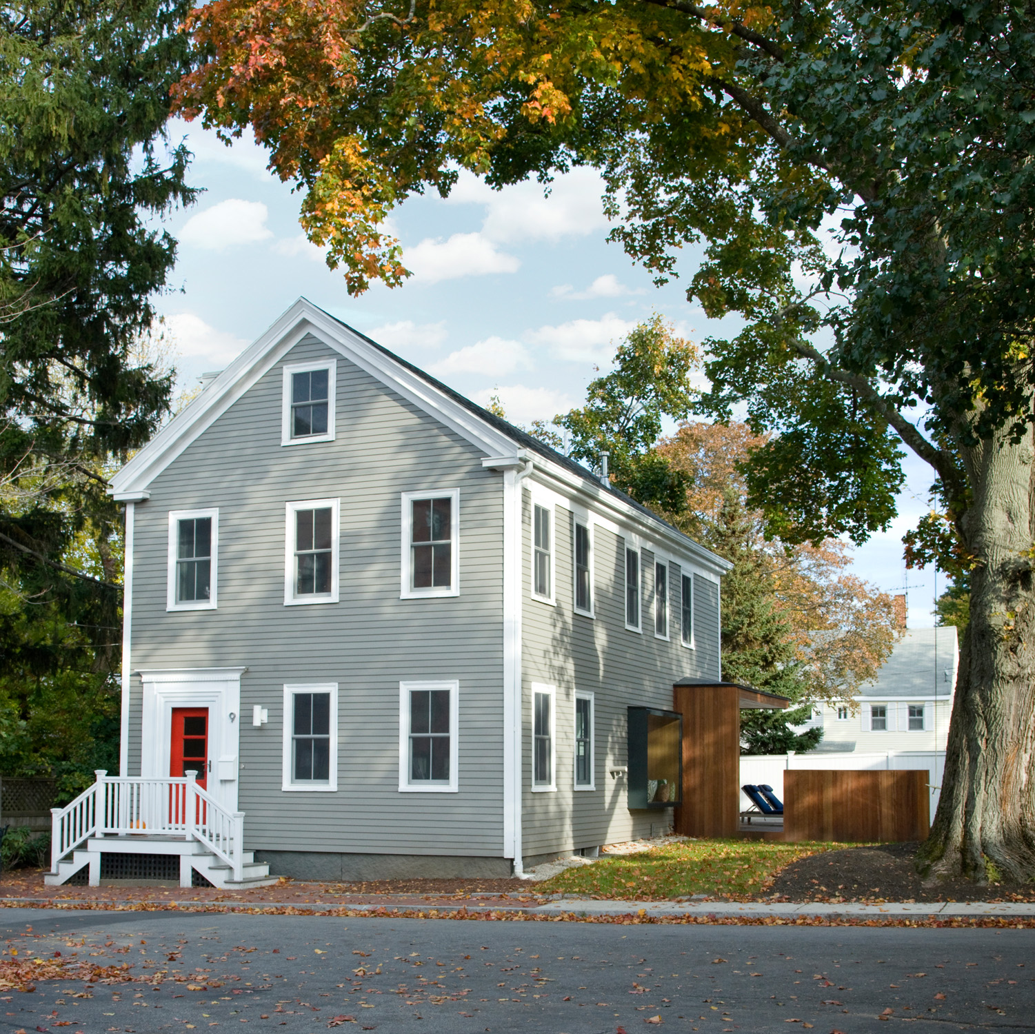 The design for this gut renovation of a nineteenth-century worker’s cottage in Newburyport enriches the historic form of an iconic “monopoly house” with contemporary interventions that open the space - up into the attic and out onto the yard.