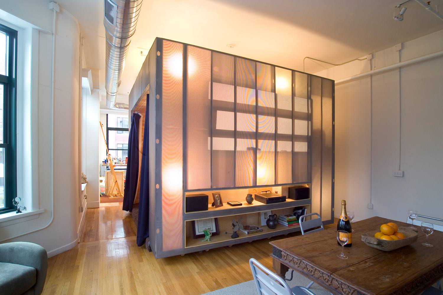 The ambiguous situation with respect to the identity of the Z-Box (it is simultaneously one thing and several) is further enhanced by the lights within its walls, which, with the flick of a switch, transform the box from prismatic steel cube into glowing lantern. 