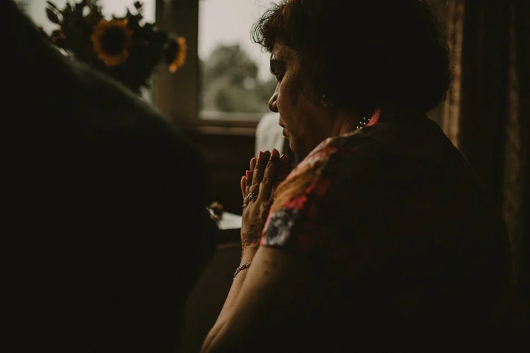 indian mother prays during puja