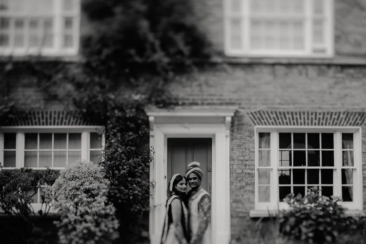 indian groom holds wife after hindu ceremony