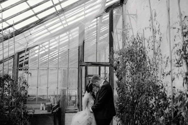 bride and groom share intimate moment in quex park wedding 