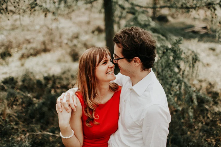 french and russian couple laugh during funny moment in london engagement