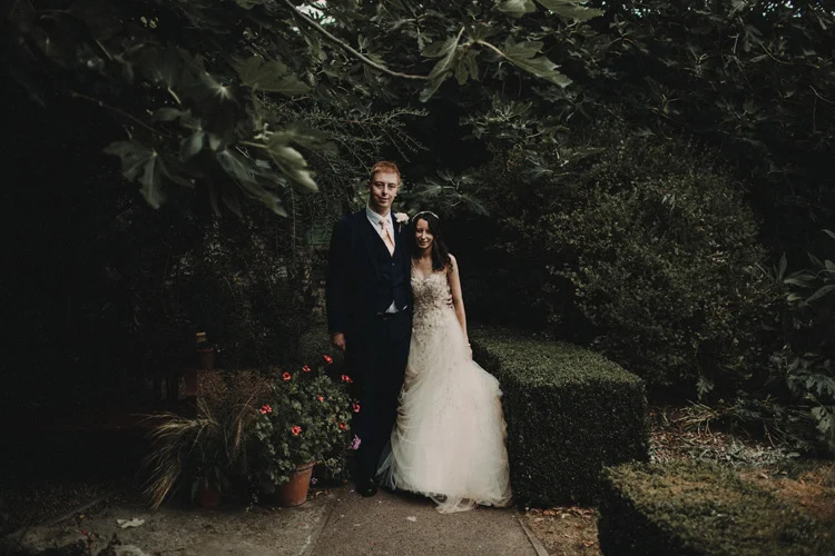 groom holds bride in quex park wedding