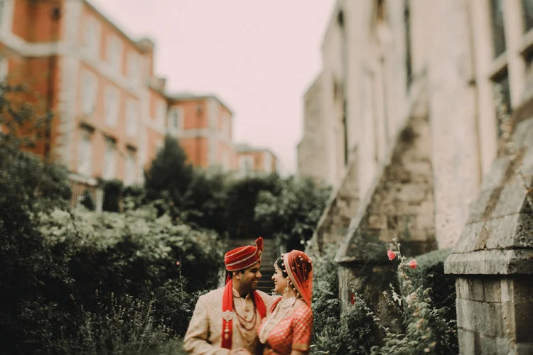 indian bride and groom hold each other after hindu ceremony