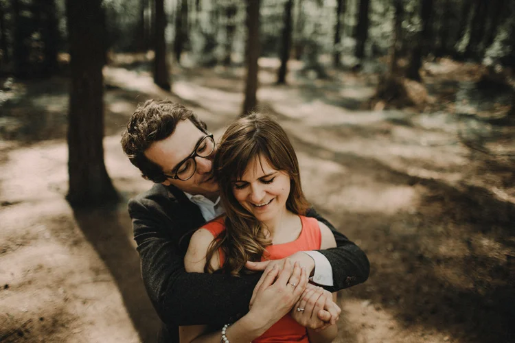 french and russian couple hold each other in intimate moment in london engagement