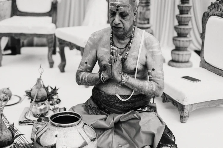 hindu preiest prays during hindu ceremony