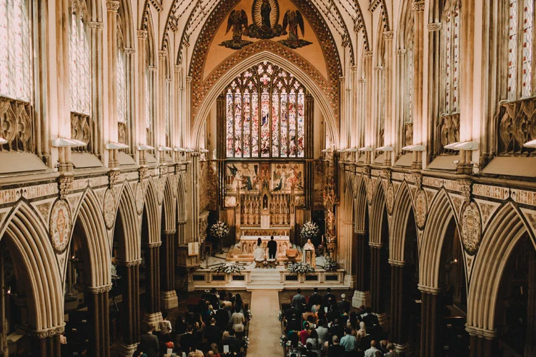 congregation stand during london city wedding