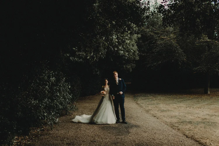english bride and groom hold hands during quex park wedding