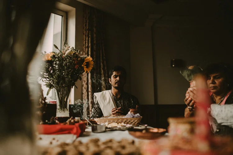 hindu priest prays during puja in southampton wedding