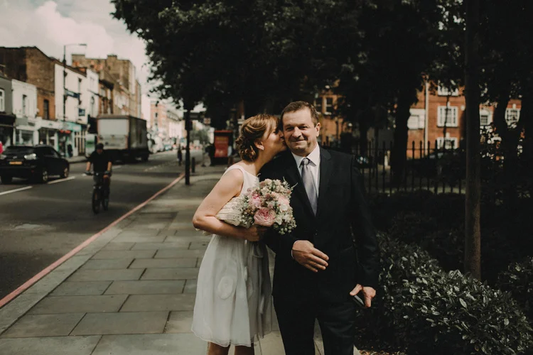 russian bride kisses father before wedding ceremony in islington wedding