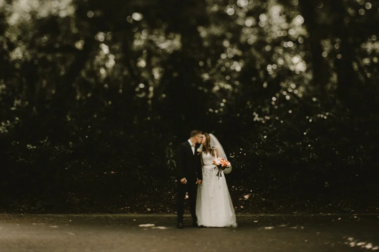 bride and groom share a kiss after london wedding