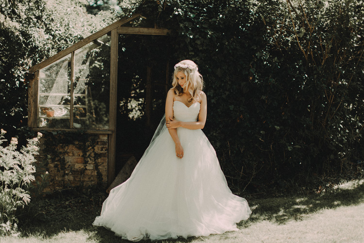 boho bride stands in garden ready for chesham wedding