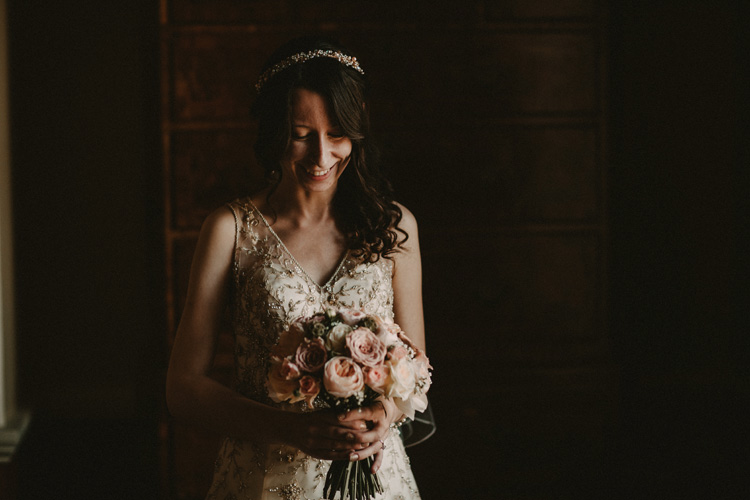 vintage bride laughs before wedding ceremony in quex park wedding
