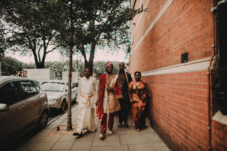 grooms precessional with family to hindu ceremony in london wedding