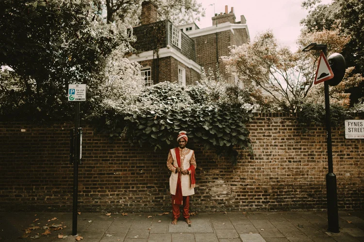 indian groom standing in london streets after hindu ceremony