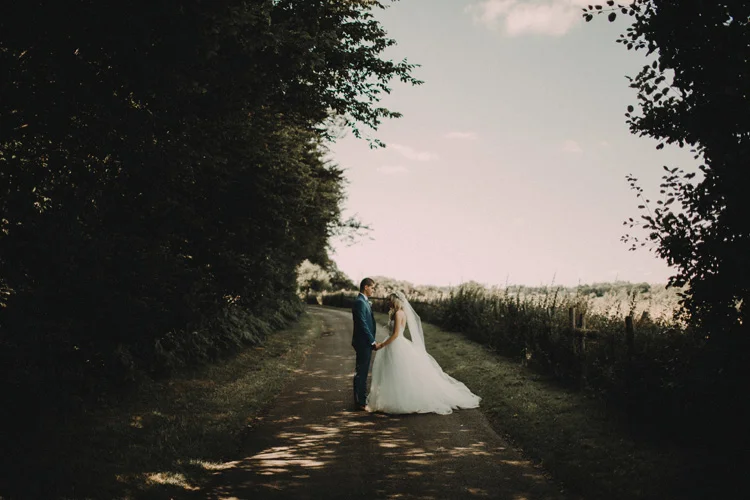 boho bride looks into grooms eyes as they share intimate moment at chesham wedding