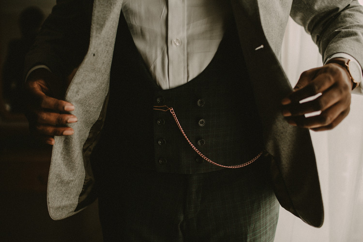 groom getting ready for froyle park wedding