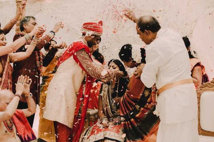 groom gives bride Mangala sutra in hindu ceremony