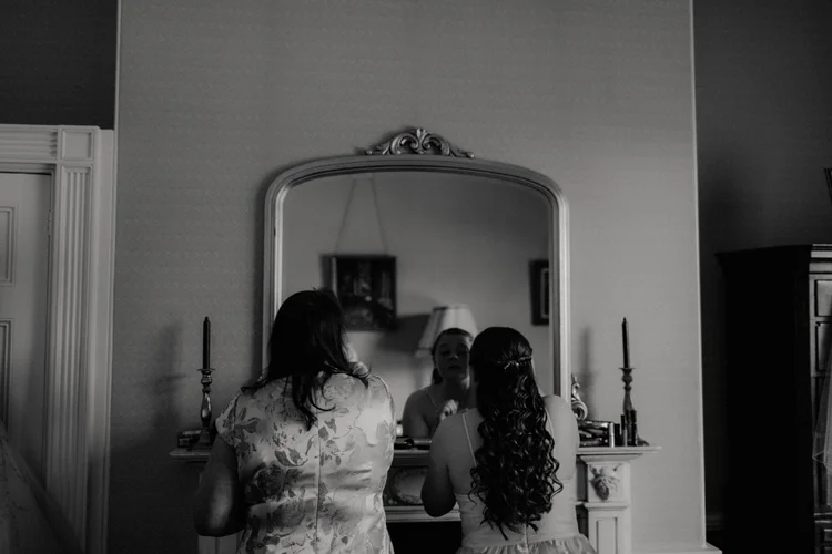 mother and daughter get ready during quex park wedding