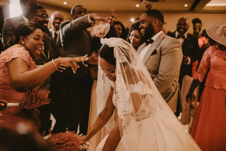 bride shares a dance with bridesmaid in froyle park wedding