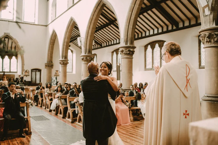 bride and groom share first kiss in london wedding