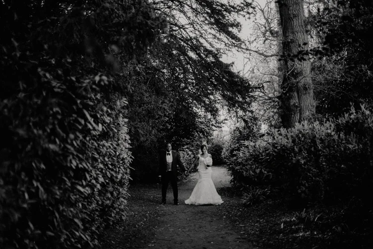 african bride and groom hold hands in hylands house wedding