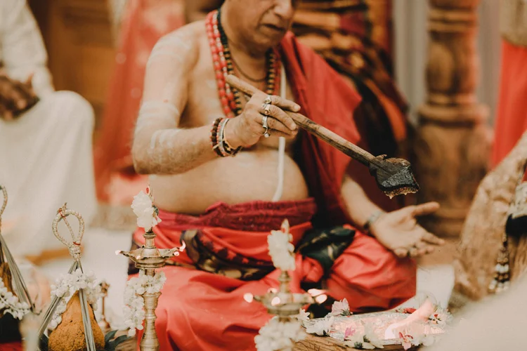hindu priest during hindu ceremony in london hindu wedding