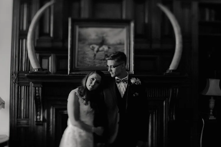 bride leans on groom during intimate moment at surrey wedding